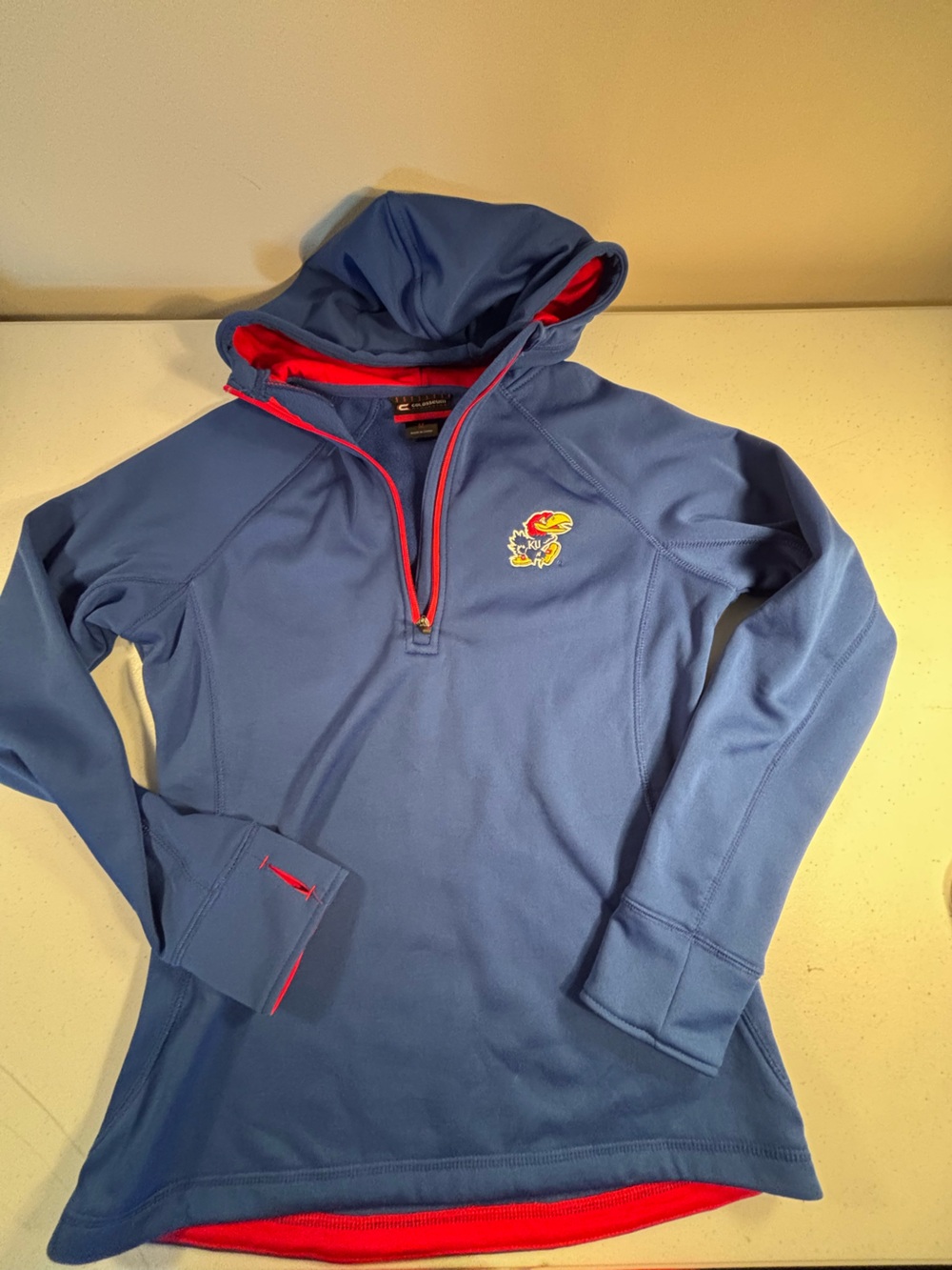 Colosseum KU Jayhawkswomen’s Blue Hooded Quarter-Zip Sweatshirt with Red Accents